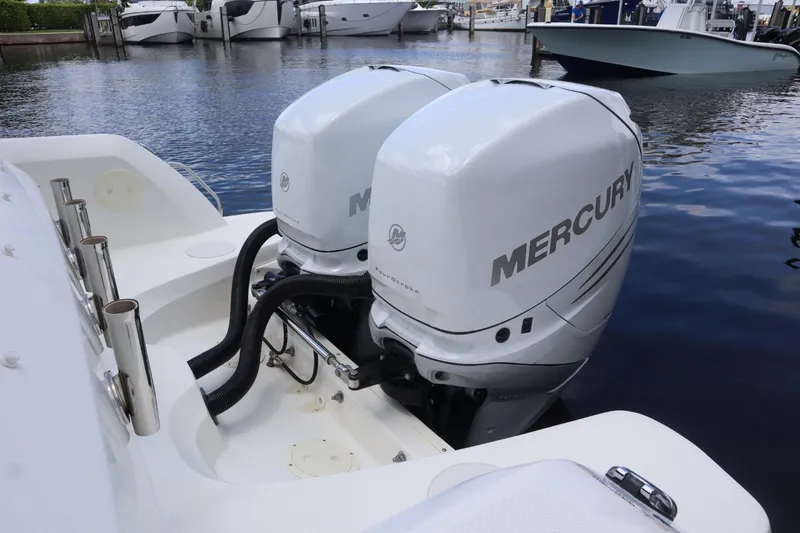 Slide: The Image of 2017 Boston Whaler 270 Vantage with dual Mercury outboard engines docked at marina. - 5