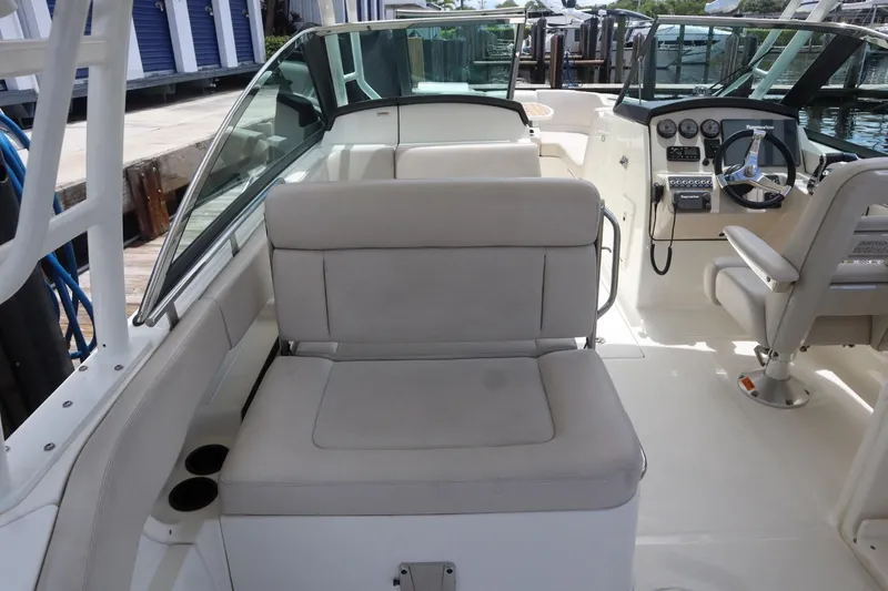 Slide: The Image of 2017 Boston Whaler 270 Vantage boat interior with seating and steering console. - 8