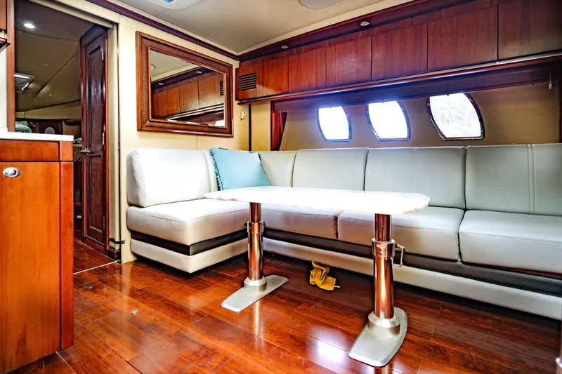 Slide: The Image of Luxurious interior of 2006 Sea Ray 48 Sundancer yacht with elegant seating and wooden finishes. - 13