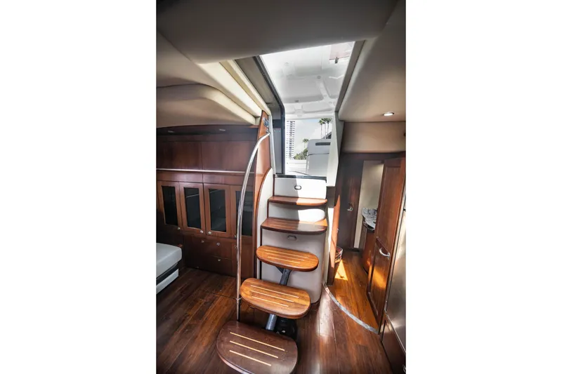 Slide: The Image of Interior of 2006 Sea Ray 48 Sundancer yacht with wooden stairs and cabinetry. - 14