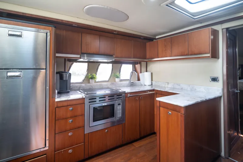 Slide: The Image of Luxurious kitchen interior of 2006 Sea Ray 48 Sundancer yacht with modern appliances. - 15
