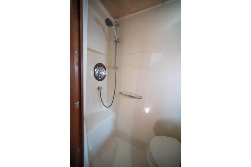 Slide: The Image of Shower area in 2006 Sea Ray 48 Sundancer yacht, featuring modern fixtures. - 18