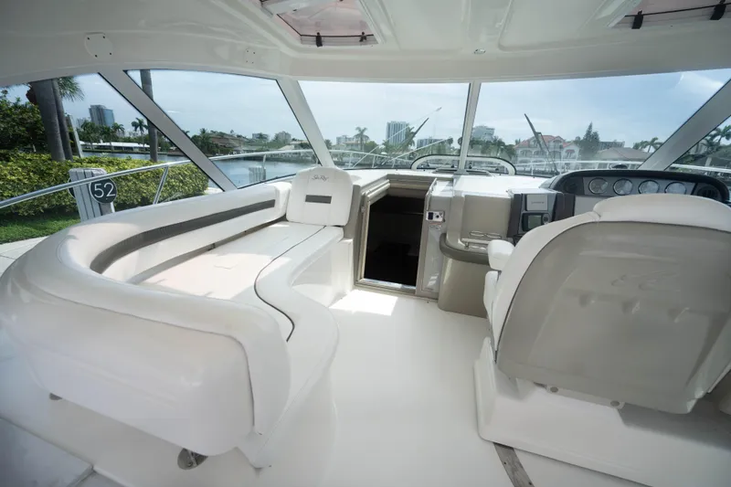 Slide: The Image of Luxurious interior of 2006 Sea Ray 48 Sundancer yacht with plush seating and helm. - 7