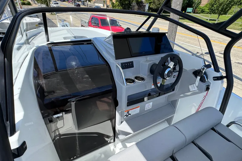 Slide: The Image of 2026 Jeanneau Leader WA 7.5 boat cockpit with modern steering and navigation controls. - 17
