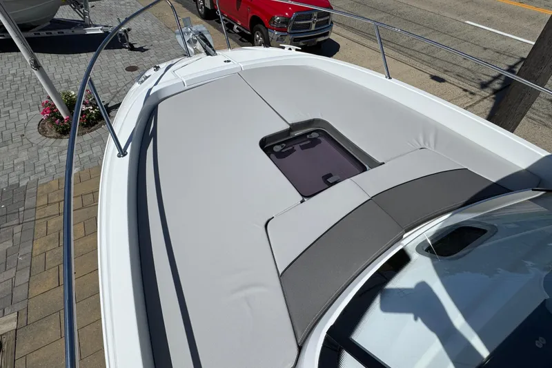 Slide: The Image of 2026 Jeanneau Leader WA 7.5 boat deck with cushioned seating and hatch. - 19