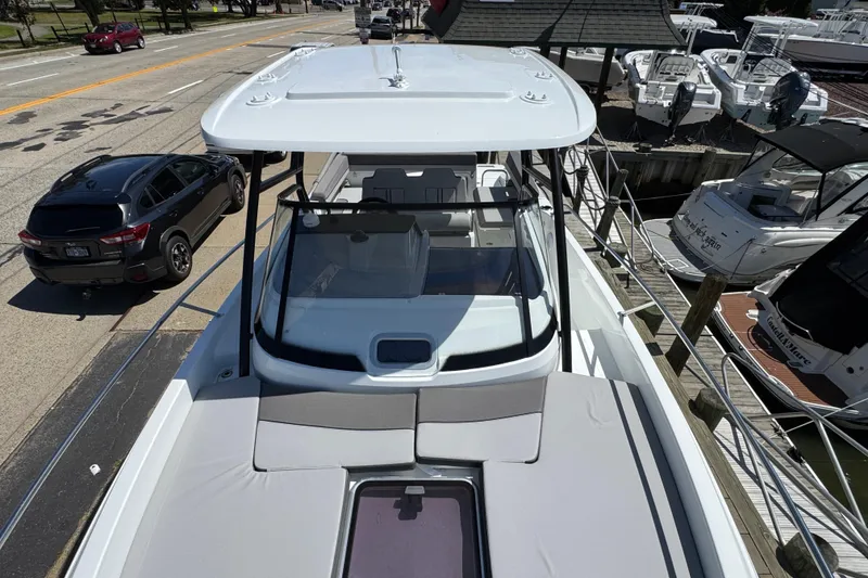 Slide: The Image of 2026 Jeanneau Leader WA 7.5 boat docked, showcasing sleek design and spacious deck. - 20