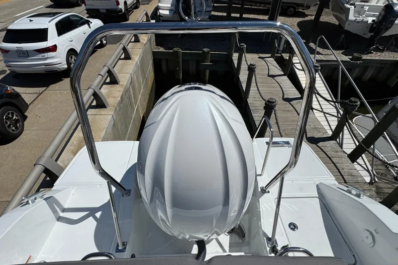 Slide: The Image of 2026 Jeanneau Leader WA 7.5 boat docked, viewed from above, with sleek design and chrome railings. - 29