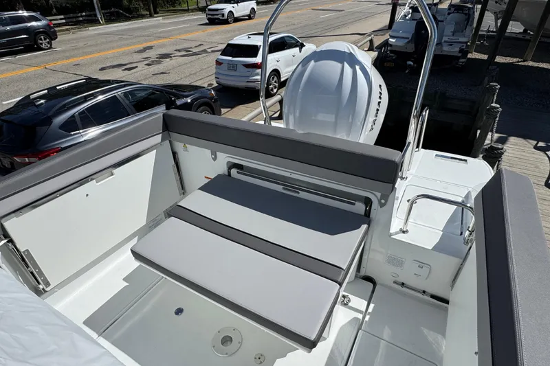 Slide: The Image of 2026 Jeanneau Leader WA 7.5 boat interior with seating and outboard motor. - 3