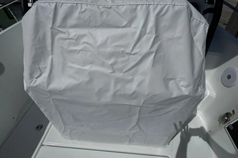 Slide: The Image of Covered console on a 2026 Jeanneau Leader WA 7.5 boat, featuring a protective fabric. - 6