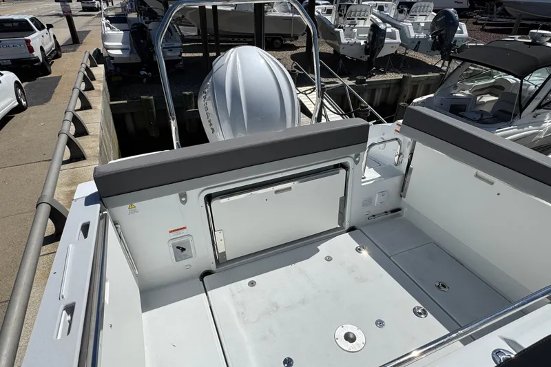 Slide: The Image of 2026 Jeanneau Leader WA 7.5 boat interior, featuring spacious deck and seating area. - 8