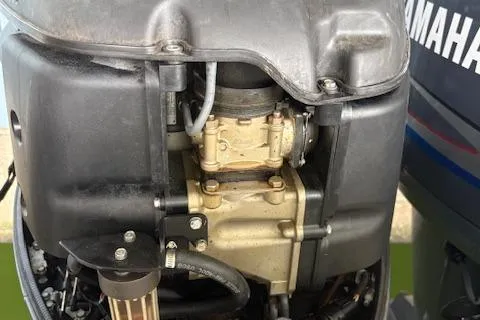 Slide: The Image of Close-up of a 2006 Intrepid 310 Walkaround engine component with visible bolts and metal casing. - 10