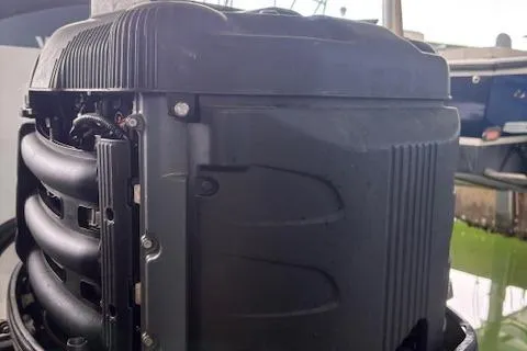 Slide: The Image of Close-up of a Yamaha outboard motor on a 2006 Intrepid 310 Walkaround boat. - 11