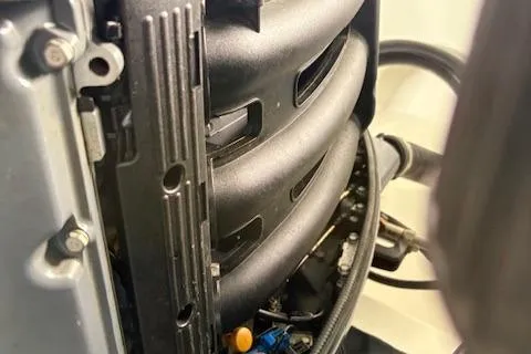 Slide: The Image of Close-up of a 2006 Intrepid 310 Walkaround engine, showcasing intricate mechanical details. - 15