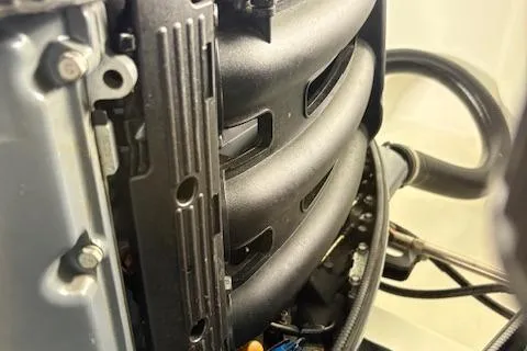 Slide: The Image of Close-up of a 2006 Intrepid 310 Walkaround engine component, showcasing intricate mechanical details. - 16