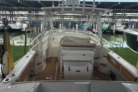 Slide: The Image of Close-up of a 2006 Intrepid 310 Walkaround engine component with visible hoses and fittings. - 17