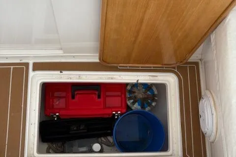 Slide: The Image of 2006 Intrepid 310 Walkaround boat interior with seating and deck view. - 29