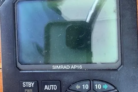 Slide: The Image of Storage compartment on a 2006 Intrepid 310 Walkaround boat with tools and equipment. - 30