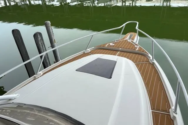 Slide: The Image of 2006 Intrepid 310 Walkaround boat interior with marina view. - 35