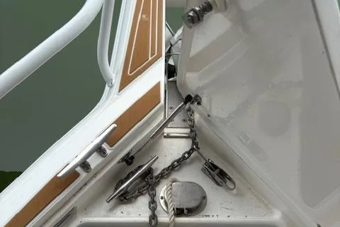 Slide: The Image of 2006 Intrepid 310 Walkaround boat deck with teak flooring, viewed from above. - 37