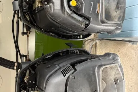 Slide: The Image of 2006 Intrepid 310 Walkaround boat deck with teak-style flooring and hatch. - 40