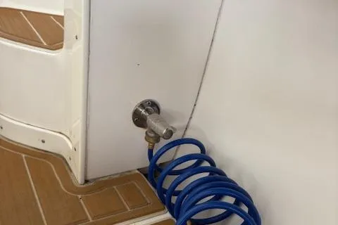 Slide: The Image of Storage compartment of a 2006 Intrepid 310 Walkaround boat with fenders and ropes. - 43