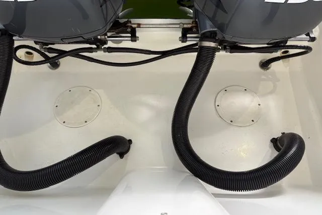 Slide: The Image of Twin 250 horsepower engines on a 2006 Intrepid 310 Walkaround boat. - 7