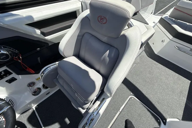 Slide: The Image of Captain's seat in a 2021 Cobalt R6 Surf boat, featuring sleek design and premium materials. - 16
