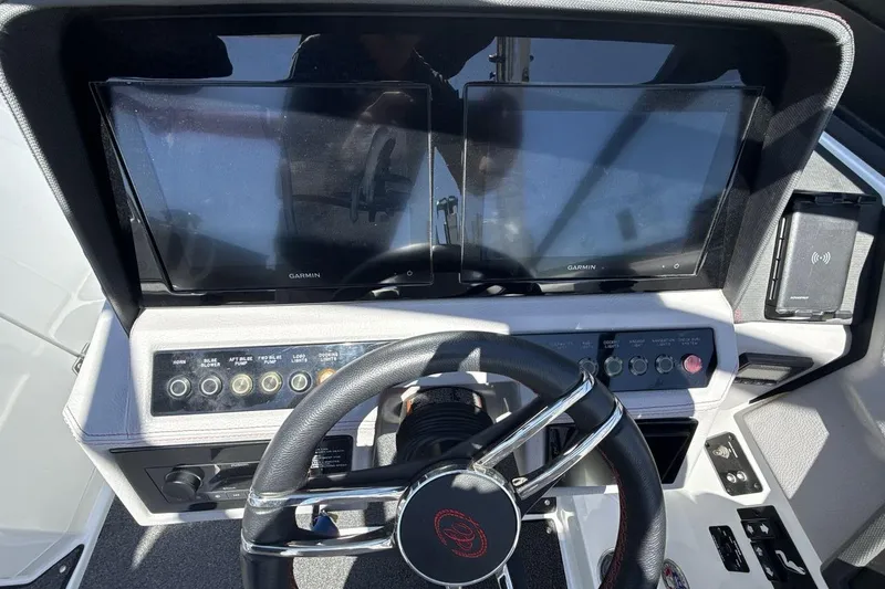 Slide: The Image of 2021 Cobalt R6 Surf dashboard with dual Garmin displays and steering wheel. - 18