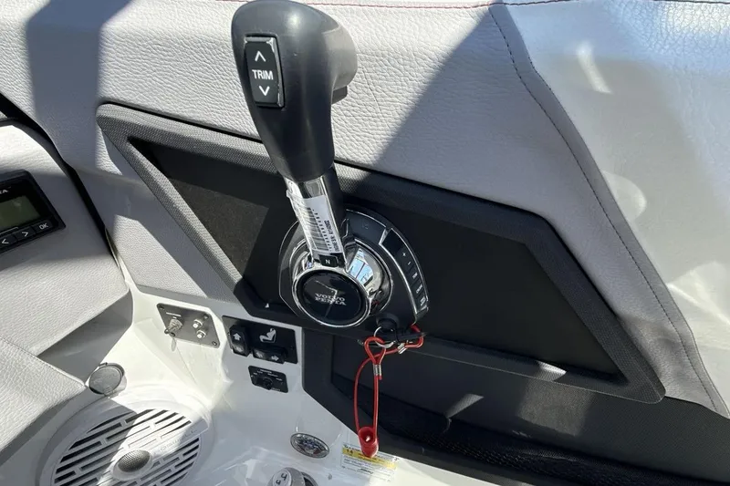 Slide: The Image of 2021 Cobalt R6 Surf boat control panel with trim lever and Volvo Penta branding. - 19
