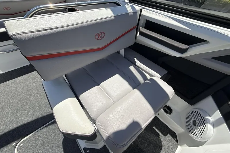 Slide: The Image of 2021 Cobalt R6 Surf boat interior with gray seating and red accents. - 20