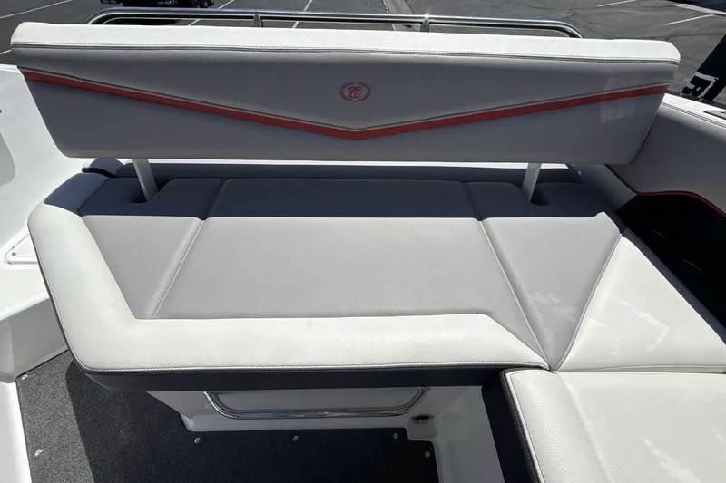 Slide: The Image of 2021 Cobalt R6 Surf boat interior seating with gray upholstery and red accents. - 22