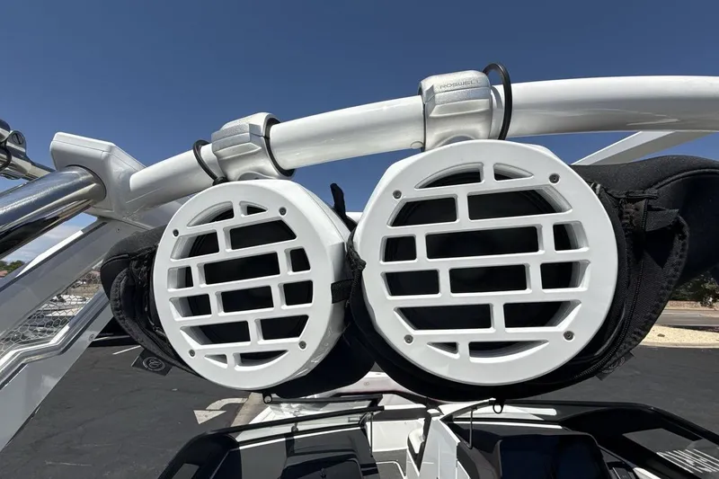 Slide: The Image of 2021 Cobalt R6 Surf boat speakers mounted on a white wakeboard tower. - 24