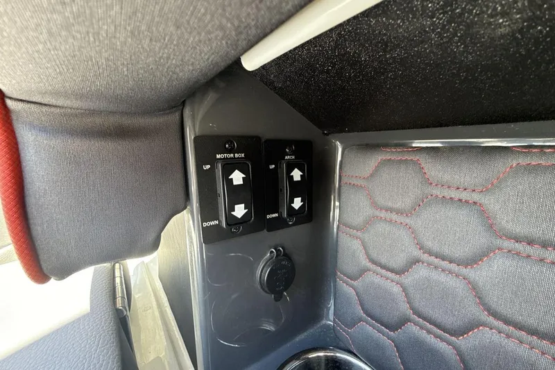 Slide: The Image of Control panel inside 2021 Cobalt R6 Surf boat with motor box and arch switches. - 26
