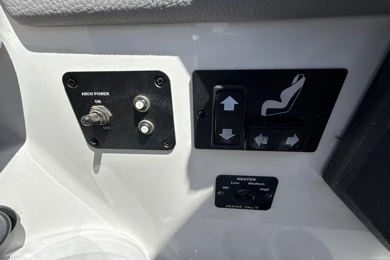 Slide: The Image of Control panel of a 2021 Cobalt R6 Surf boat with switches and heater settings. - 27