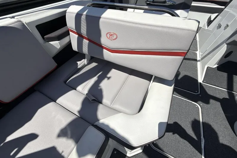 Slide: The Image of 2021 Cobalt R6 Surf boat interior with gray and red-accented seating. - 28