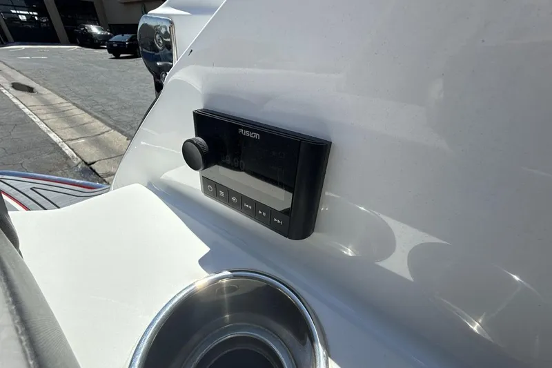 Slide: The Image of 2021 Cobalt R6 Surf boat dashboard with Fusion audio system and cup holder. - 29