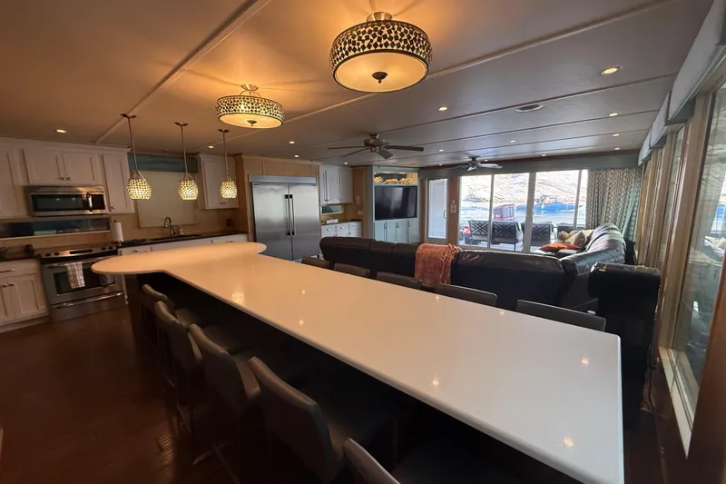 Slide: The Image of Luxurious houseboat interior with modern kitchen, spacious seating, and elegant lighting, STARDUST Oceans Share #2, 2015. - 16