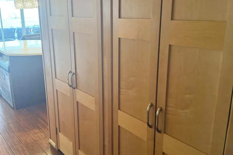 Slide: The Image of Wooden cabinets in a kitchen area of a 2015 STARDUST Oceans Share #2. - 23