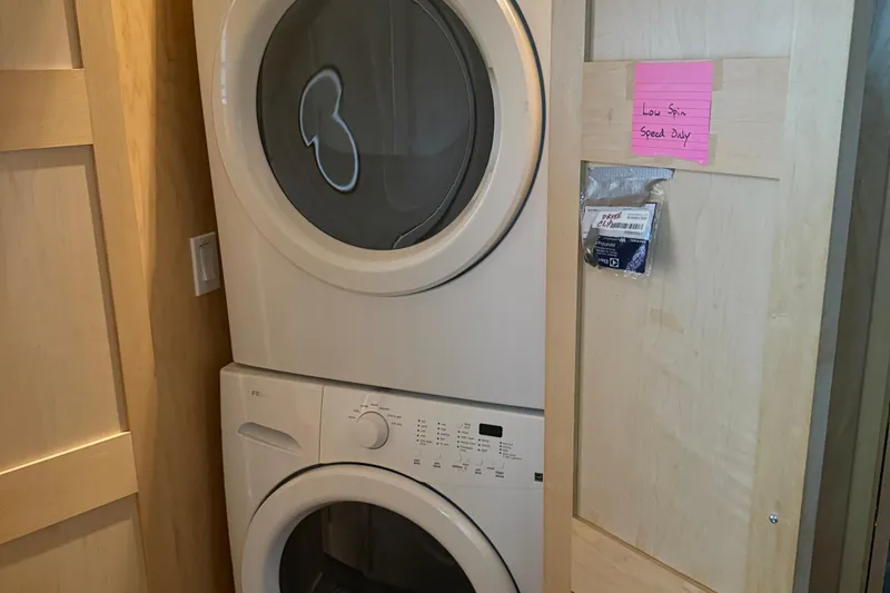 Slide: The Image of Stacked washer and dryer in wooden alcove, STARDUST Oceans Share #2, 2015 model. - 24