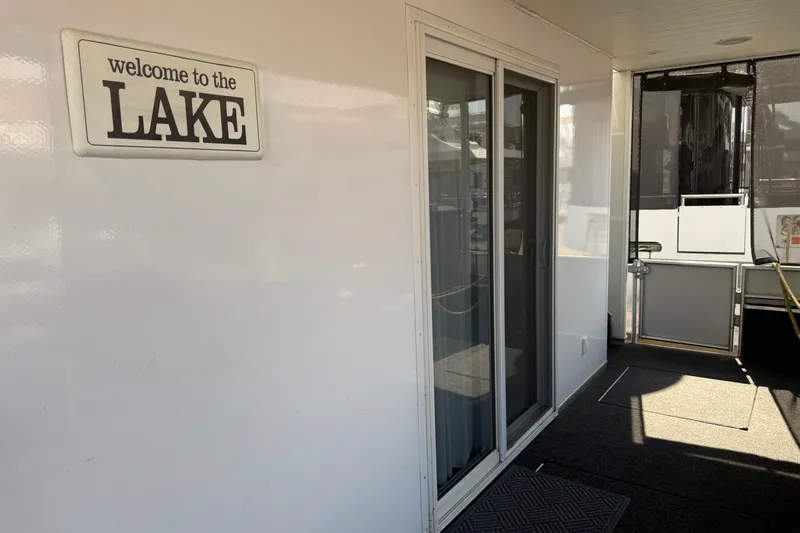 Slide: The Image of "Welcome to the Lake" sign on STARDUST Oceans Share #2 houseboat, 2015 model. - 28
