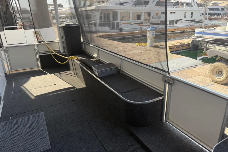 Slide: The Image of Enclosed deck area of 2015 STARDUST Oceans Share #2 houseboat at marina. - 29