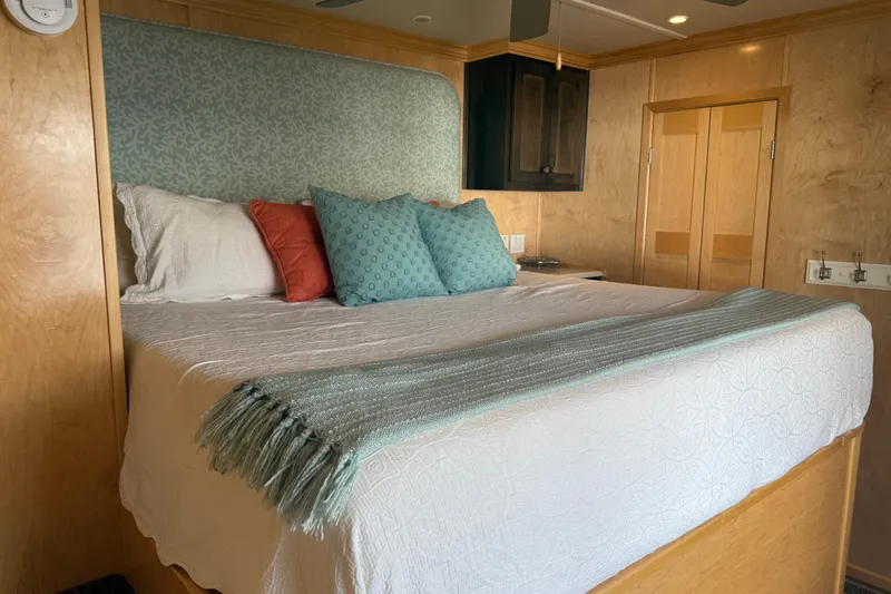 Slide: The Image of Luxurious bedroom in STARDUST Oceans Share #2, 2015 model, featuring elegant bedding and wooden decor. - 31