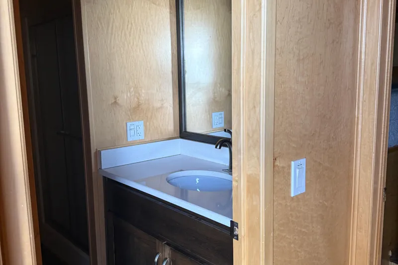 Slide: The Image of Wood-paneled bathroom with sink and mirror in STARDUST Oceans Share #2, 2015 model. - 32