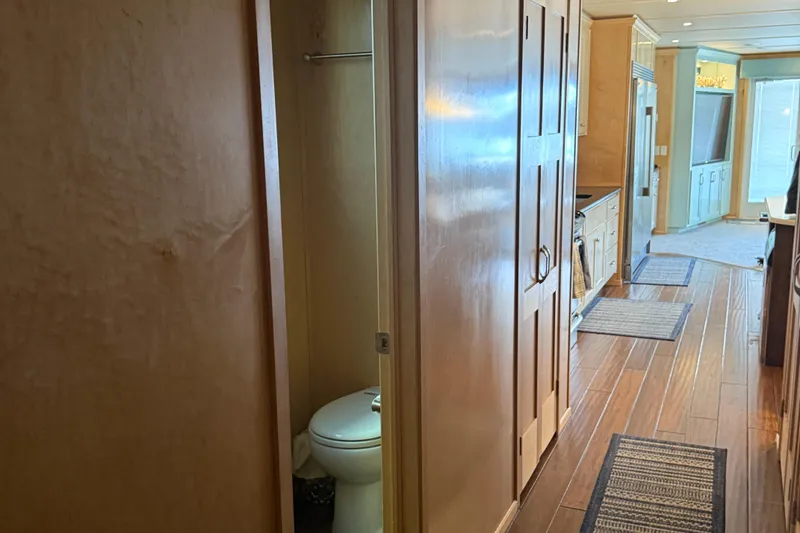 Slide: The Image of Interior of 2015 Stardust Cruisers Oceans Share #2, featuring hallway, bathroom, and kitchen area. - 34