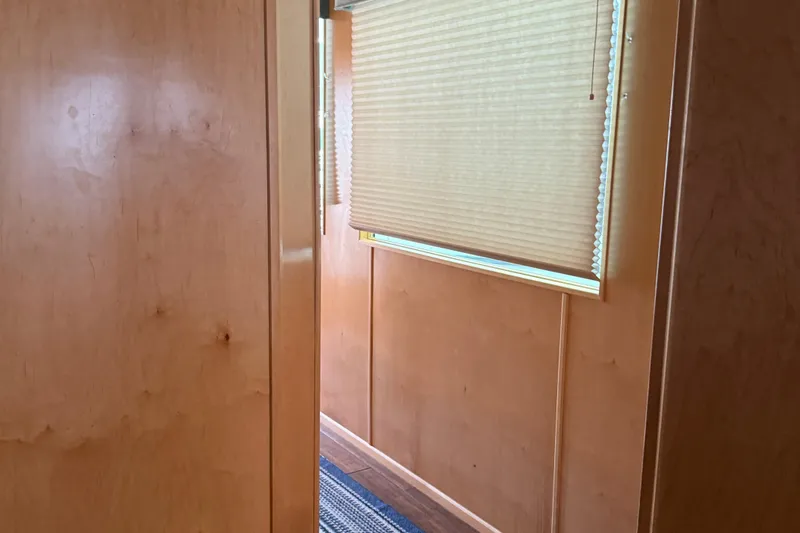 Slide: The Image of Wood-paneled interior of STARDUST Oceans Share #2, 2015, with window blinds and carpet. - 35