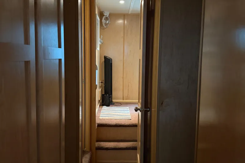 Slide: The Image of Hallway inside STARDUST Oceans Share #2, 2015 model, featuring wooden walls and carpeted steps. - 40