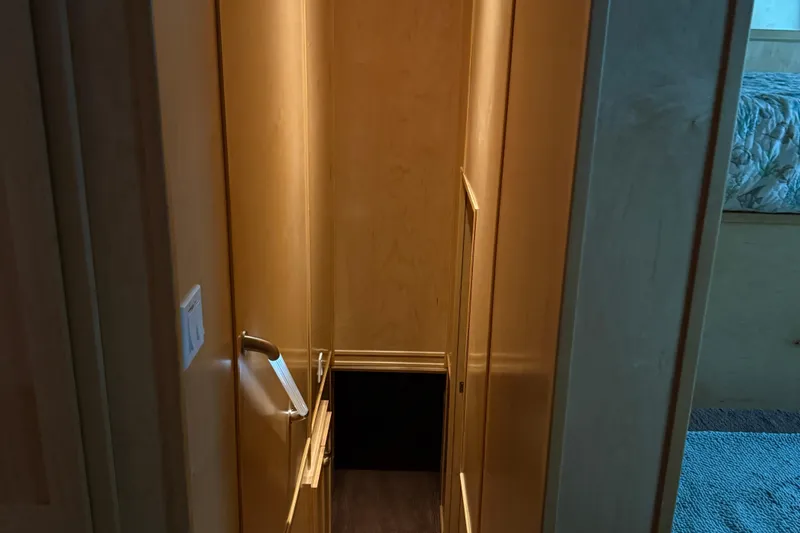 Slide: The Image of Narrow wooden staircase in STARDUST Oceans Share #2, 2015 model, leading to lower level. - 46