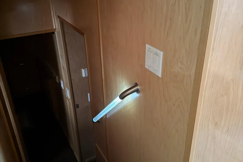 Slide: The Image of Wooden interior with illuminated handrail and light switches, STARDUST Oceans Share #2, 2015. - 48