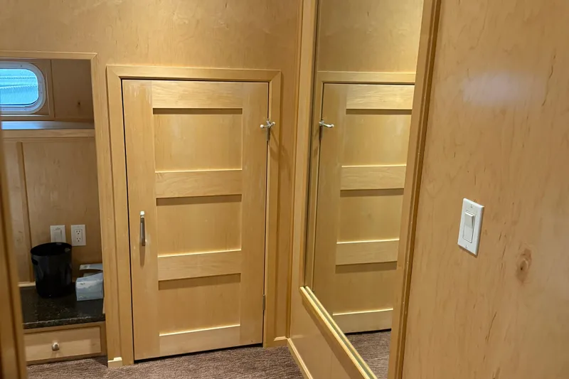 Slide: The Image of Wooden interior of STARDUST Oceans Share #2, 2015, featuring doors and a mirror. - 52