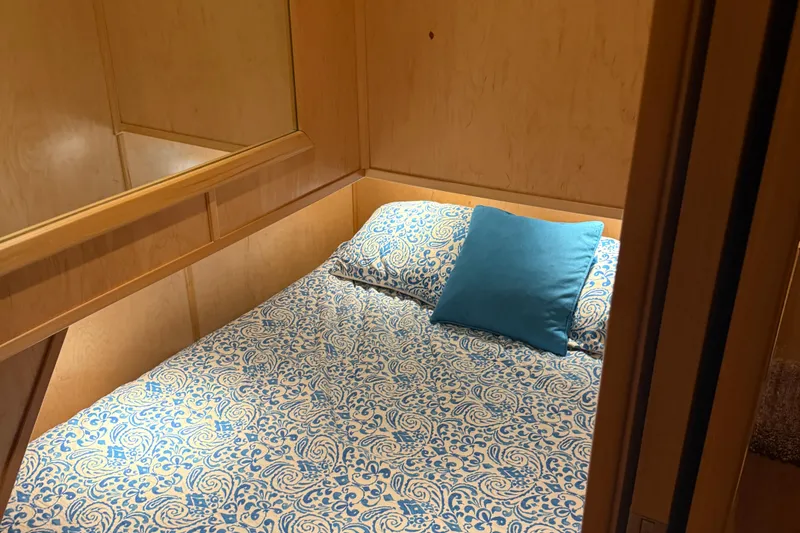 Slide: The Image of Cozy cabin bed with blue patterned bedding in STARDUST Oceans Share #2, 2015 model. - 60